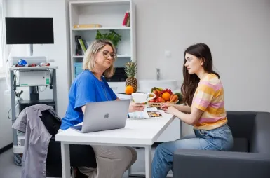 Our campus | WSB Merito Opole University: A student with teacher