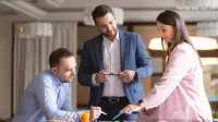 Cloud DevOps Engineer Administrator | Studia podyplomowe w Opolu | Uniwersytet WSB Merito Opole: Główna grafika: Opole - studia podyplomowe -Cloud DevOps Engineer Administrator - uczestnicy studiów podyplomowych analizują notatki leżące na stole